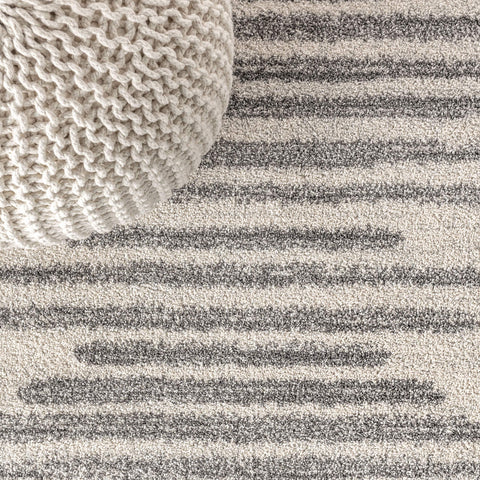 JONATHAN Y rug edge and jute backing visible, demonstrates stable durable construction