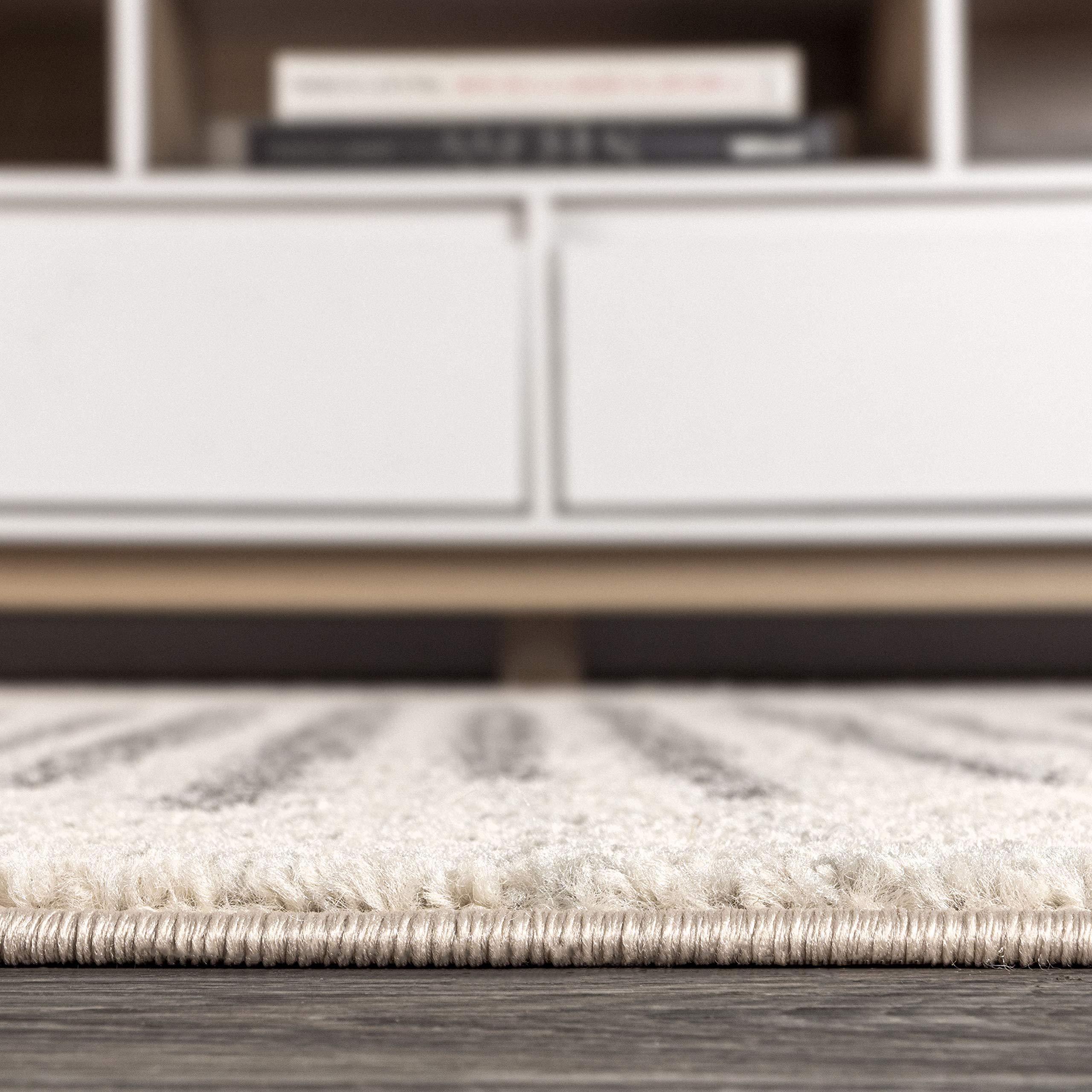 JONATHAN Y folded rug for storage, illustrates flexible lightweight handling