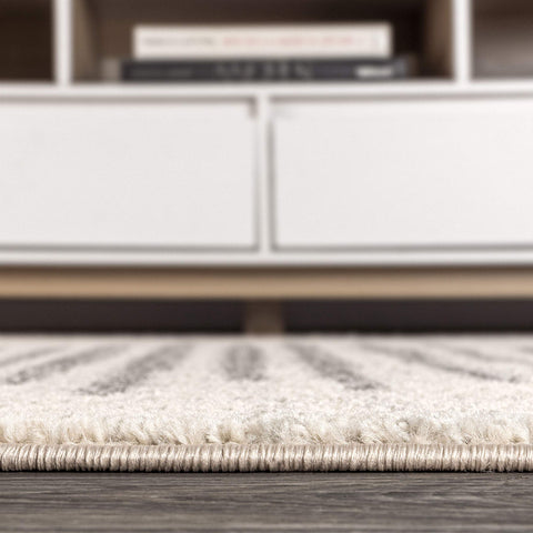 JONATHAN Y folded rug for storage, illustrates flexible lightweight handling
