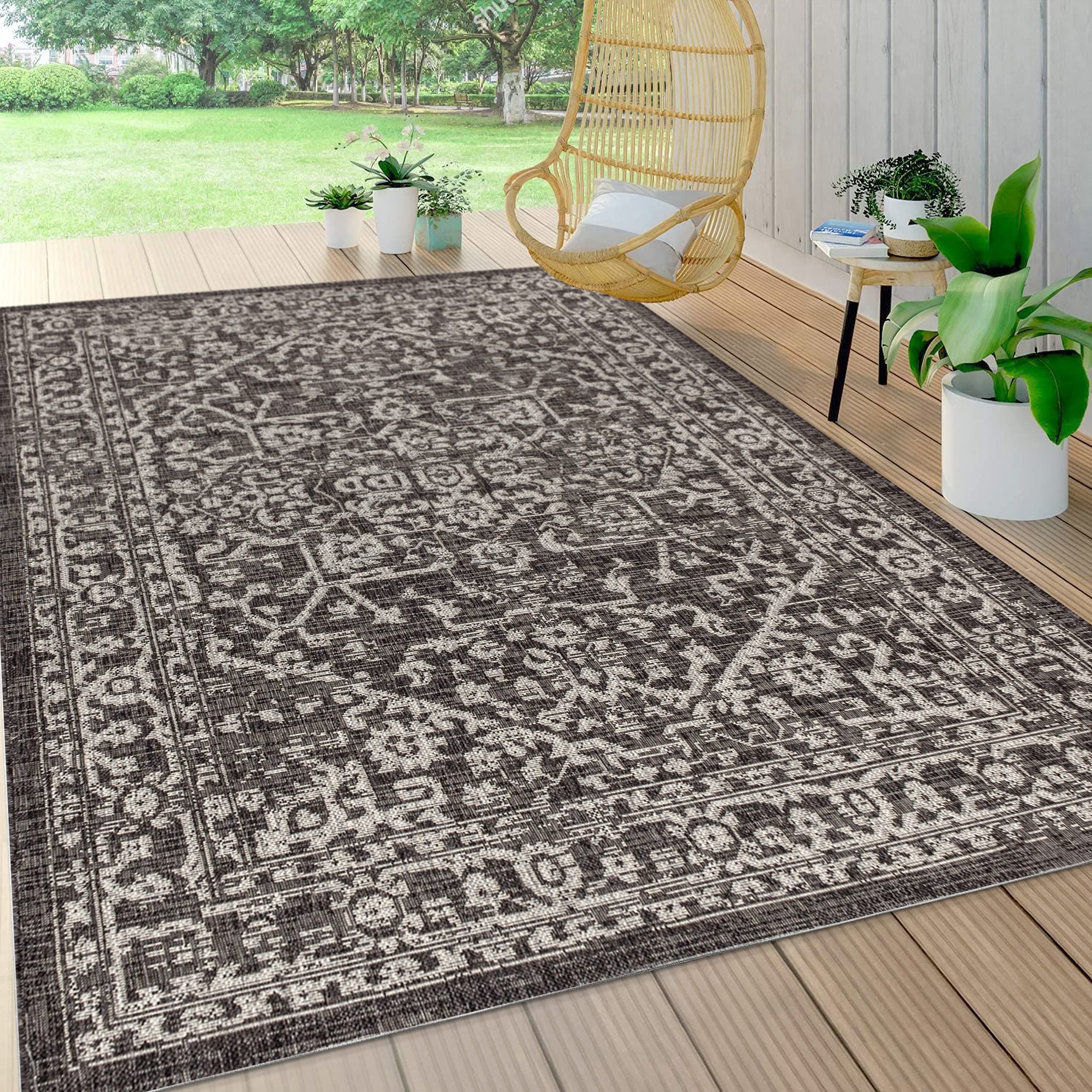 JONATHAN Y rug staged on a patio highlighting weather-ready outdoor use