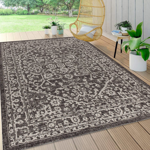 JONATHAN Y rug staged on a patio highlighting weather-ready outdoor use