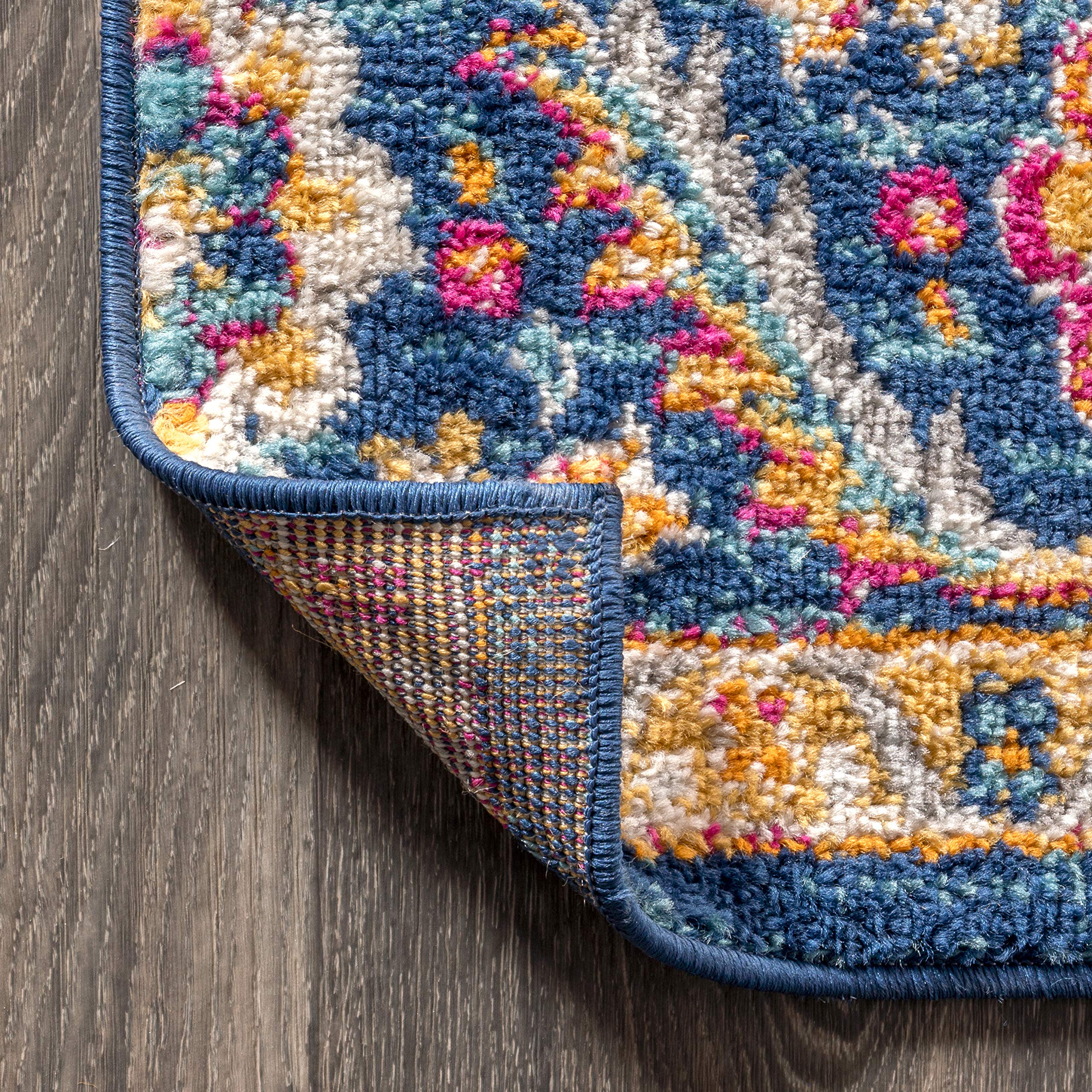 JONATHAN Y rug at kitchen entrance — easy-clean surface for busy areas