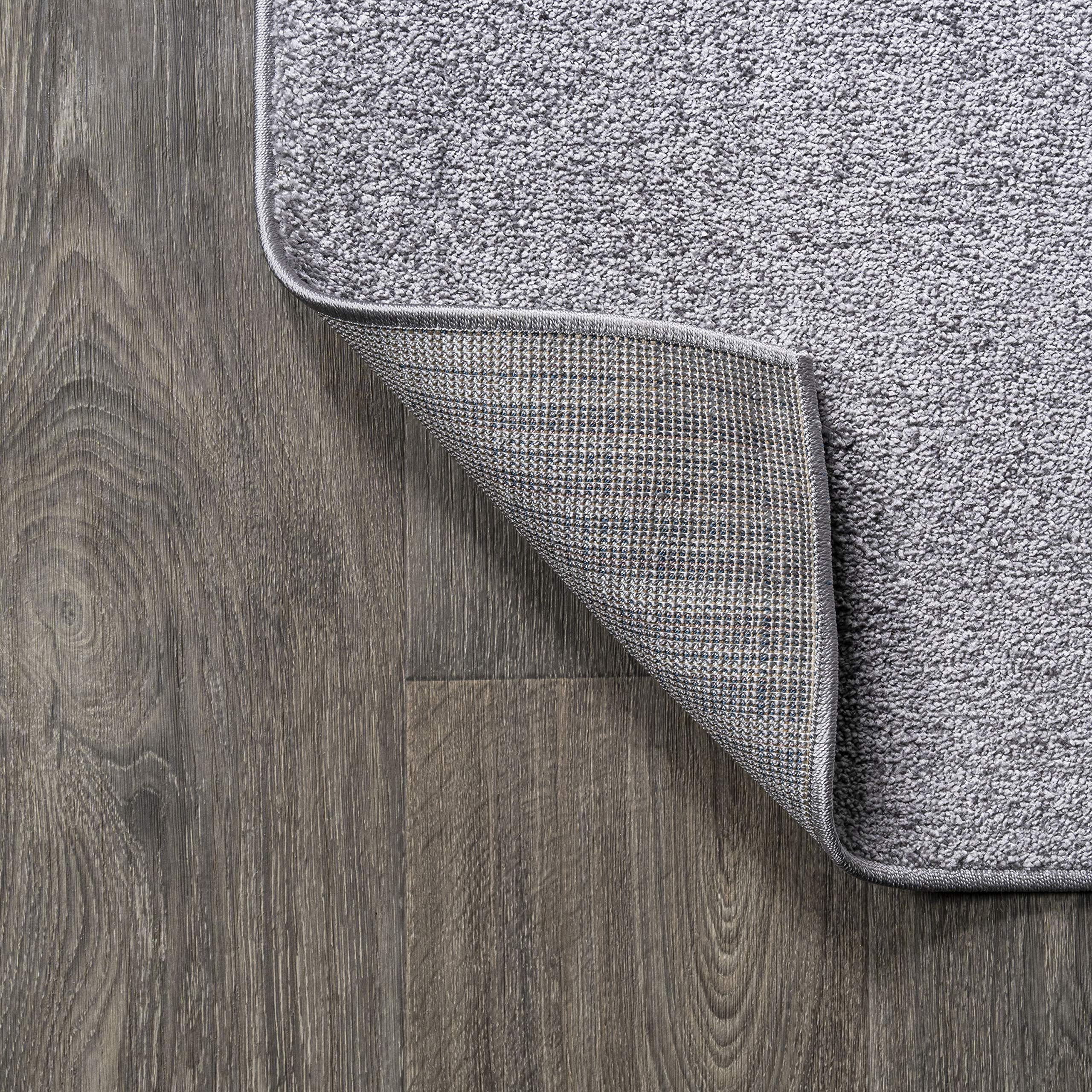 JONATHAN Y rug under small dining set showing correct scale and chair clearance