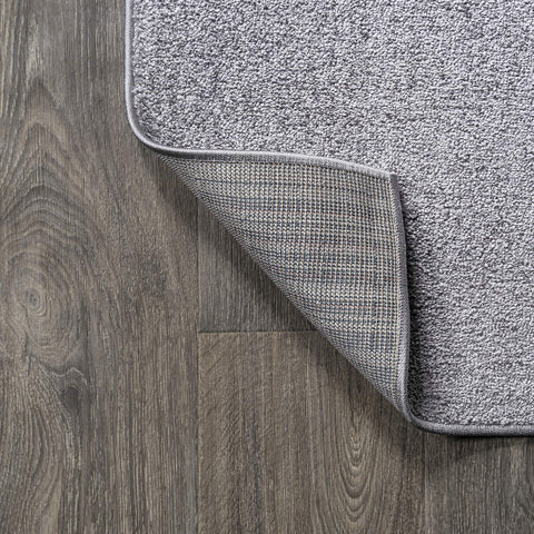 JONATHAN Y rug under small dining set showing correct scale and chair clearance