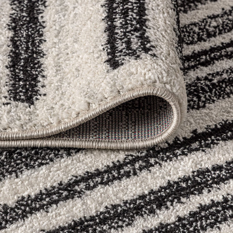 JONATHAN Y vacuum being used on Khalil rug to demonstrate easy-care maintenance