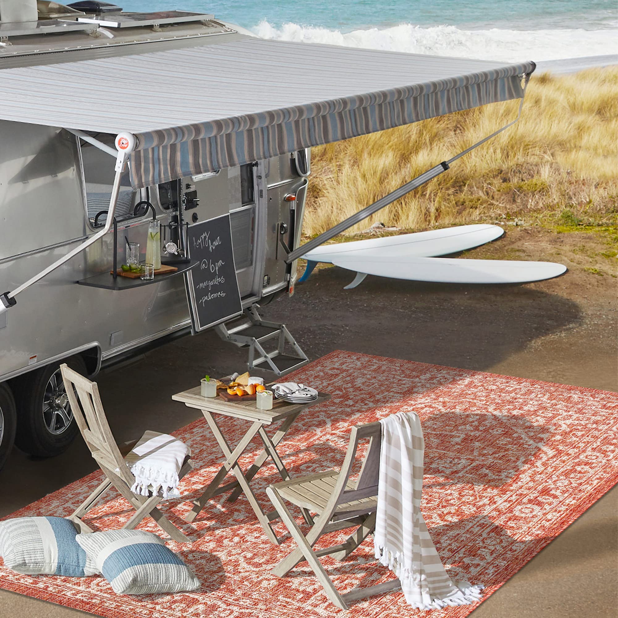 JONATHAN Y rug staged on a patio with furniture, creates cohesive outdoor living