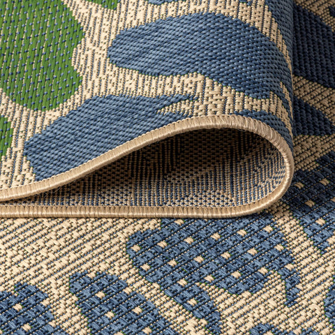 JONATHAN Y rug placed under patio furniture showing stability and scale benefit