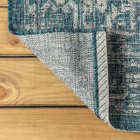 JONATHAN Y rug with chair to show 5x8 scale and room-fit benefit