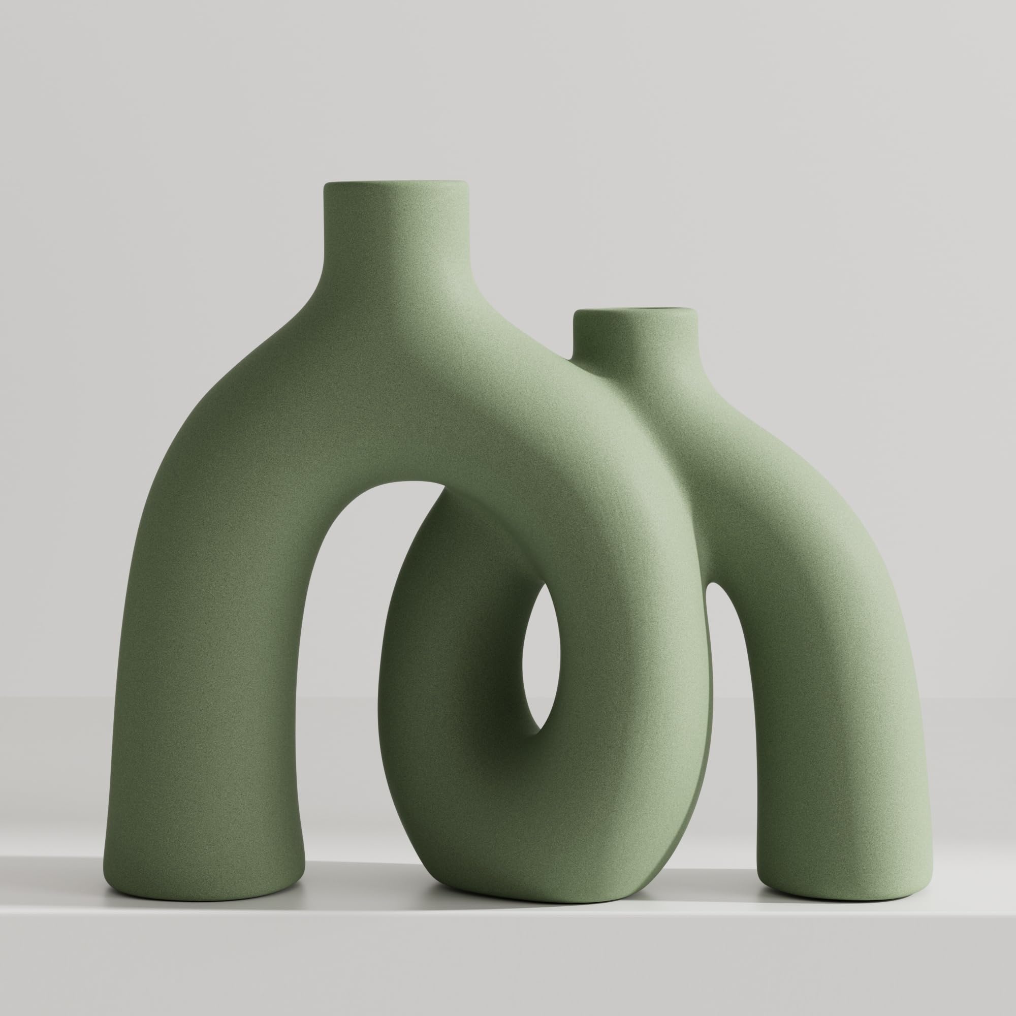 Jonronboci Hug Donut front view showing sculptural sage green form and versatile accent