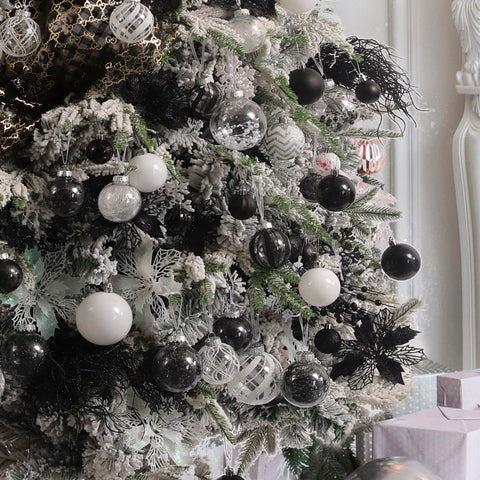 Jorysics hanging ornaments in a window scene, creates airy ambiance