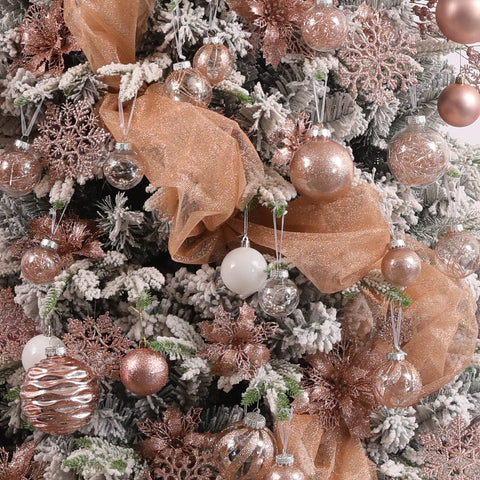 Jorysics ornament hanging on Christmas tree, adding elegant rose-gold sparkle