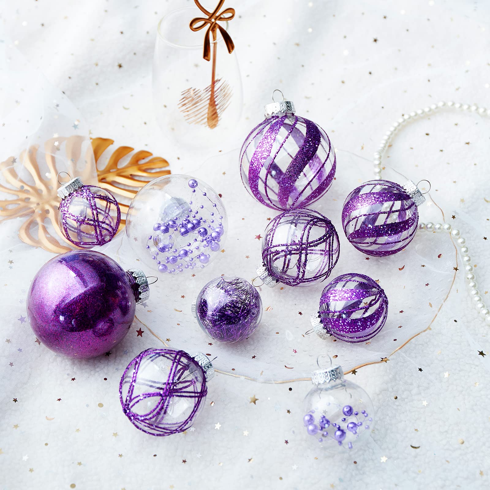 Jorysics tree display with ornaments reflecting lights for festive ambiance