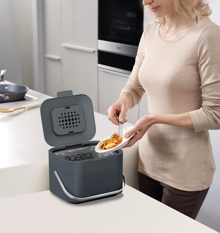 Joseph Joseph lifestyle scene on kitchen counter illustrating convenient composting and low-odor benefit