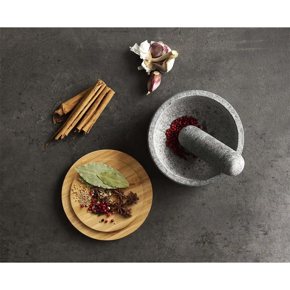 Joseph Joseph Dash beside kitchen scale, clear size and capacity benefit