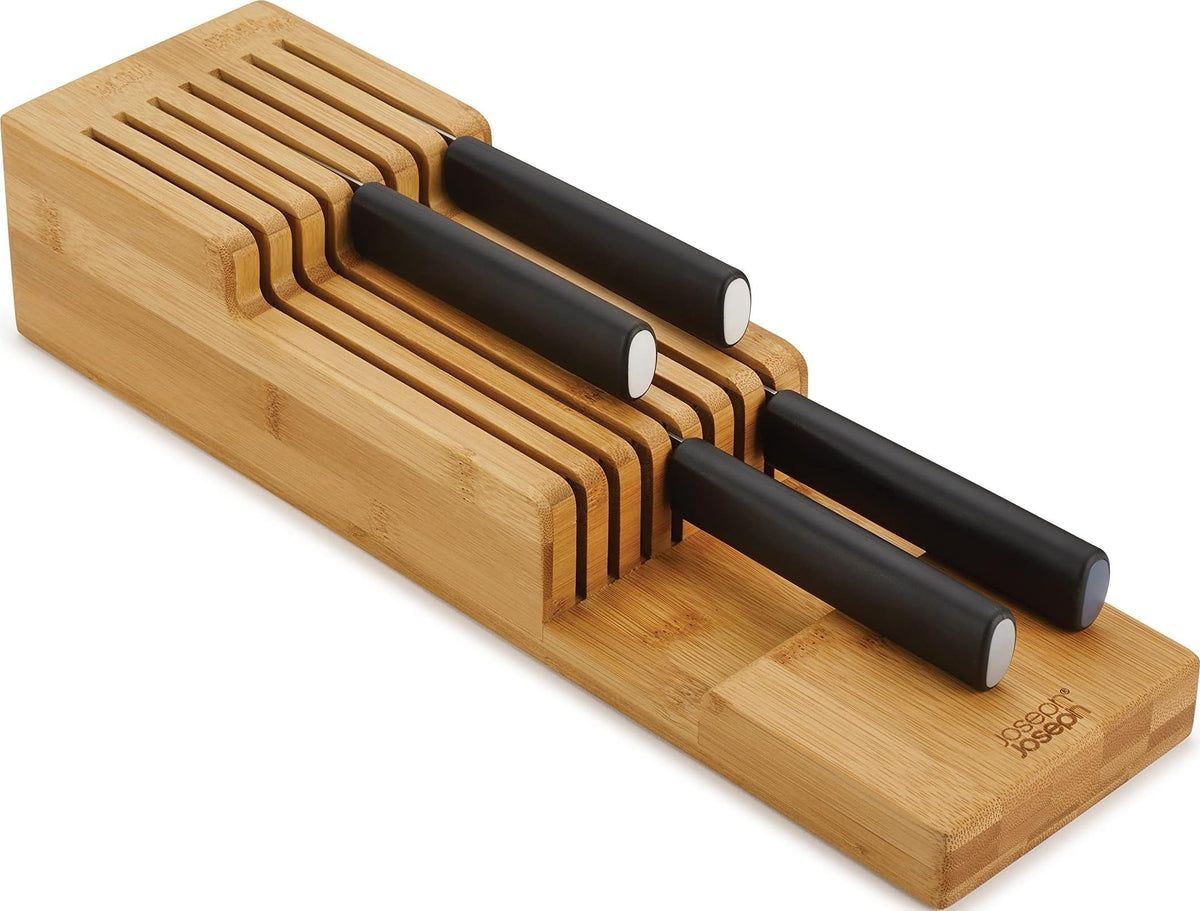 Joseph Joseph front view of compact bamboo knife organizer showing nine slots and tidy storage benefit