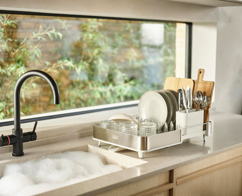 Joseph Joseph drying rack on kitchen counter in use keeps countertops tidy while air-drying dishes benefit