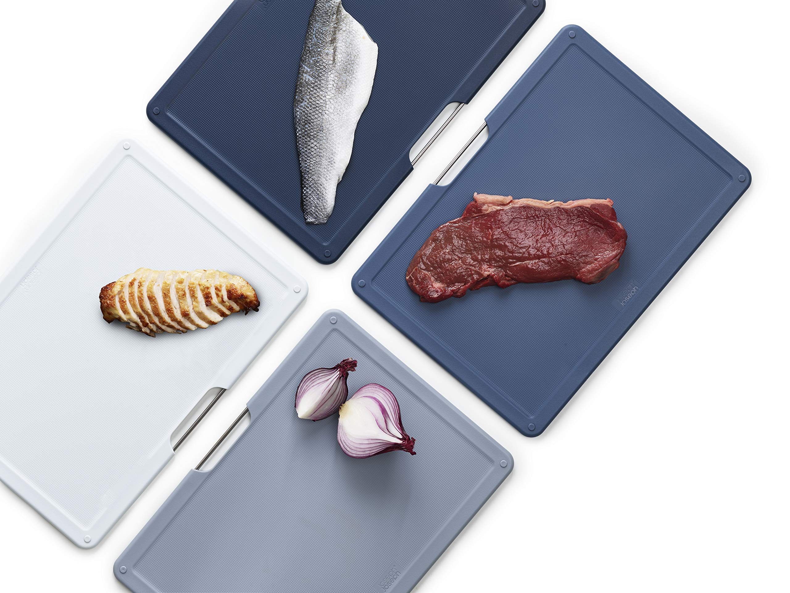 Joseph Joseph board in use chopping vegetables to demonstrate hygienic food separation benefit