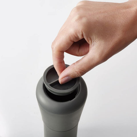 Joseph Joseph mill being inverted and base twisted to grind, enabling mess-free seasoning