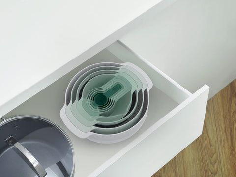 Joseph Joseph colander draining pasta showing the set in practical kitchen use benefit