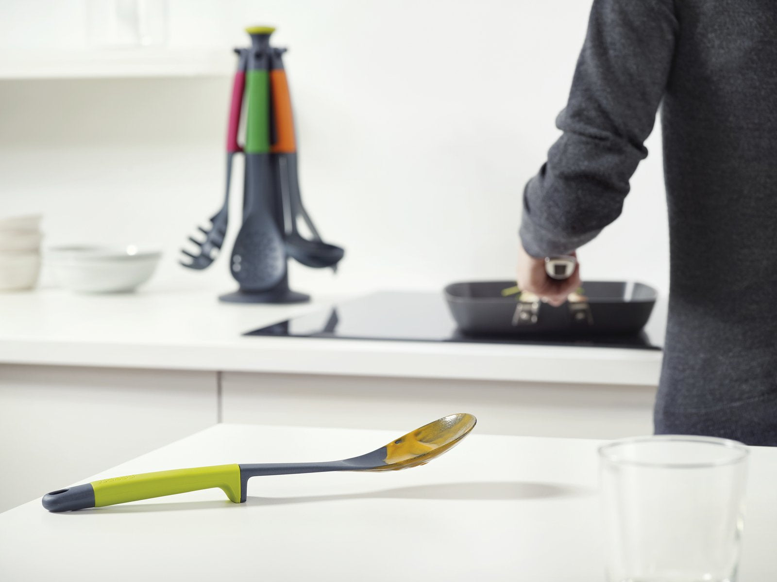 Joseph Joseph slotted spoon head detail showing drain slots and gentle cookware contact