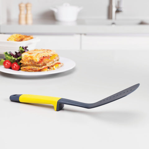 Joseph Joseph slotted turner flipping pancake showing sturdy support and non-scratch head