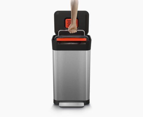 Joseph Joseph Titan foot pedal being pressed for hands-free compaction, hygienic use