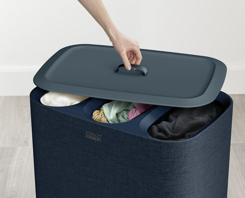 Joseph Joseph scale comparison with person showing compact space-saving benefit