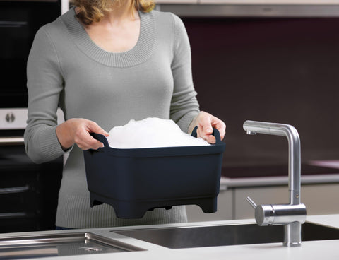 Joseph Joseph wash & drain in sink demonstrating no-lift draining convenience