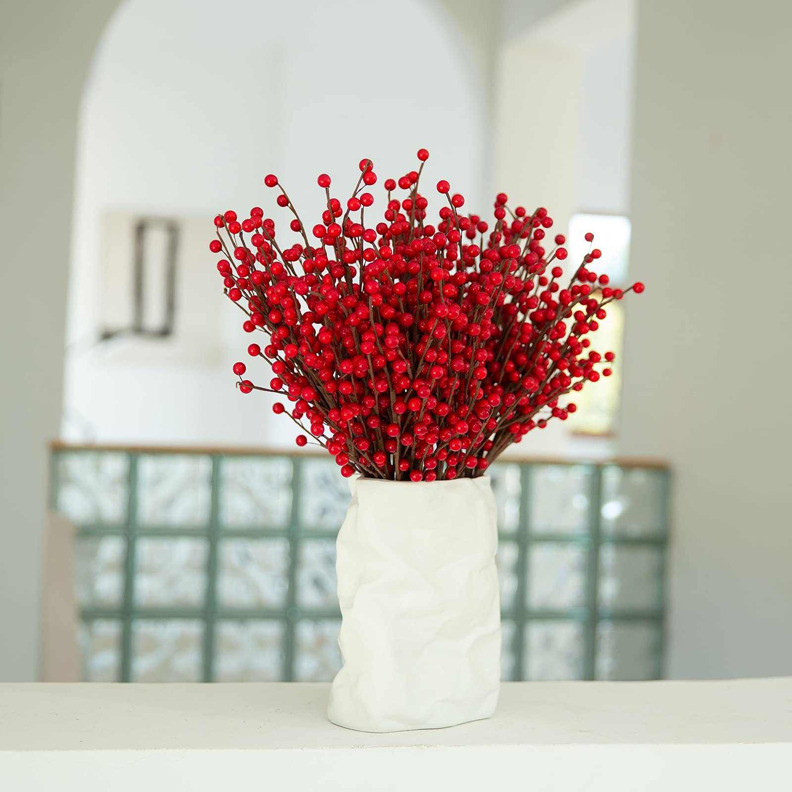 joyhalo wreath decorated with red berries adding fullness and festive color
