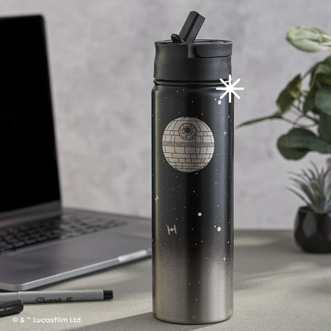 JoyJolt Death Star bottle on outdoor table lifestyle benefit: travel-ready hydration