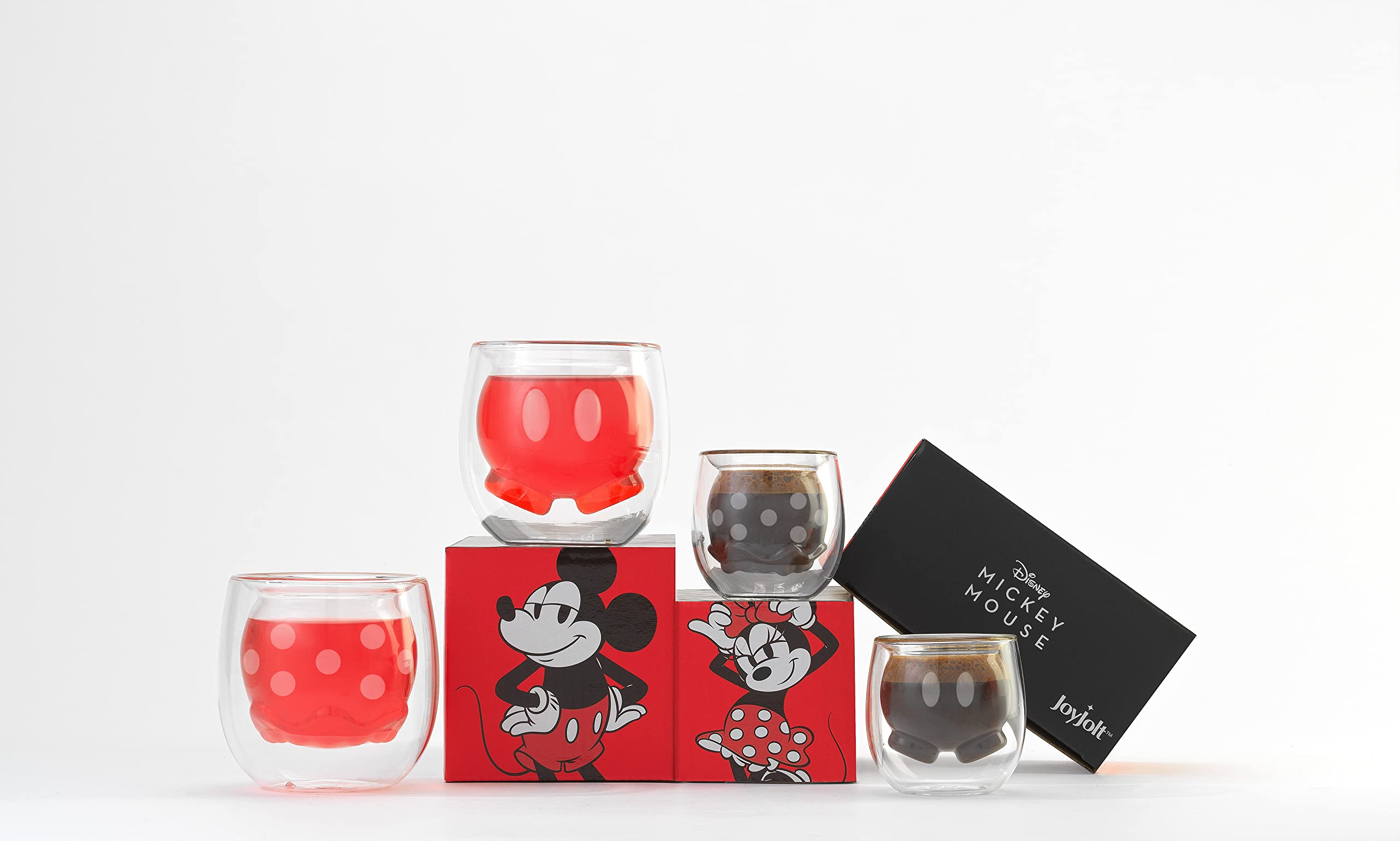 JoyJolt espresso pour into glass showing safe heat protection and aesthetic appeal