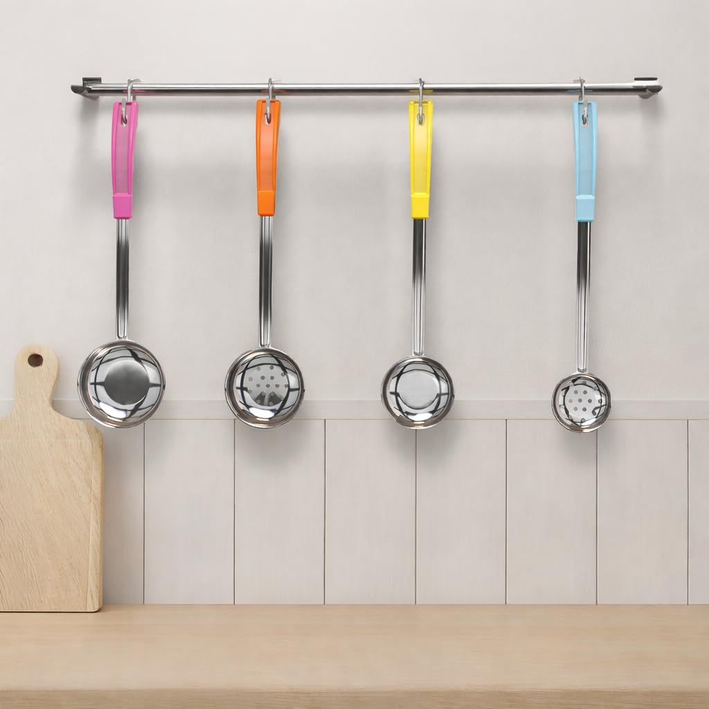 JoyServe spoon held next to hand for scale, shows ergonomic length and comfortable reach