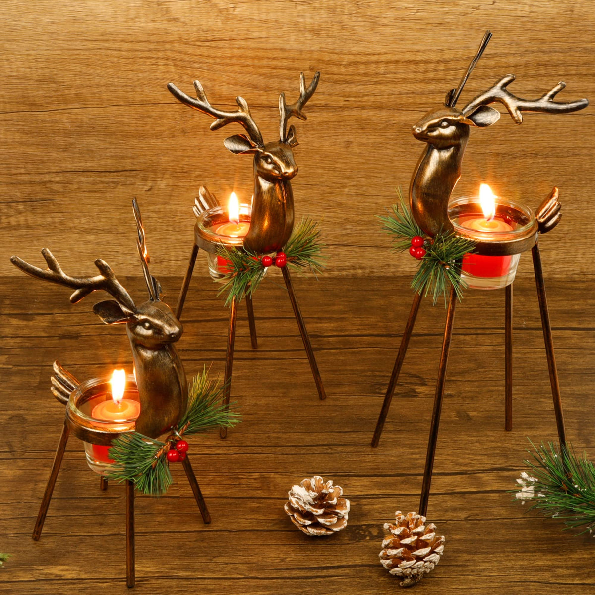 Juegoal front view of three reindeer holders showing bronze finish and glass cups for festive tables