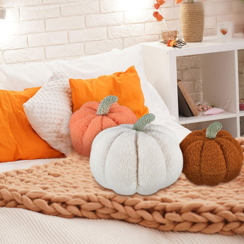 Juexica pumpkins on a bed creating a cozy seasonal vignette for restful spaces