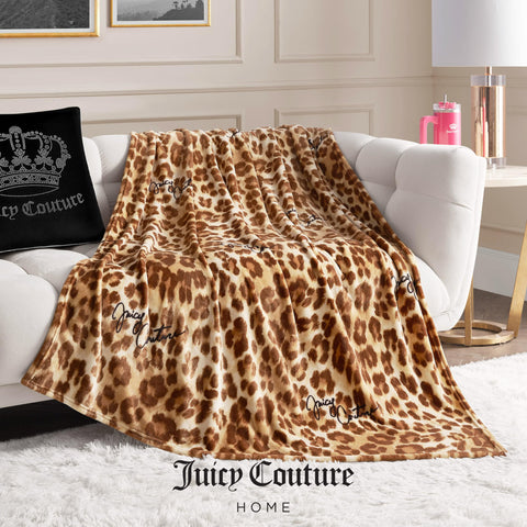 Juicy Couture draped over bed for layered decorative bedroom appeal