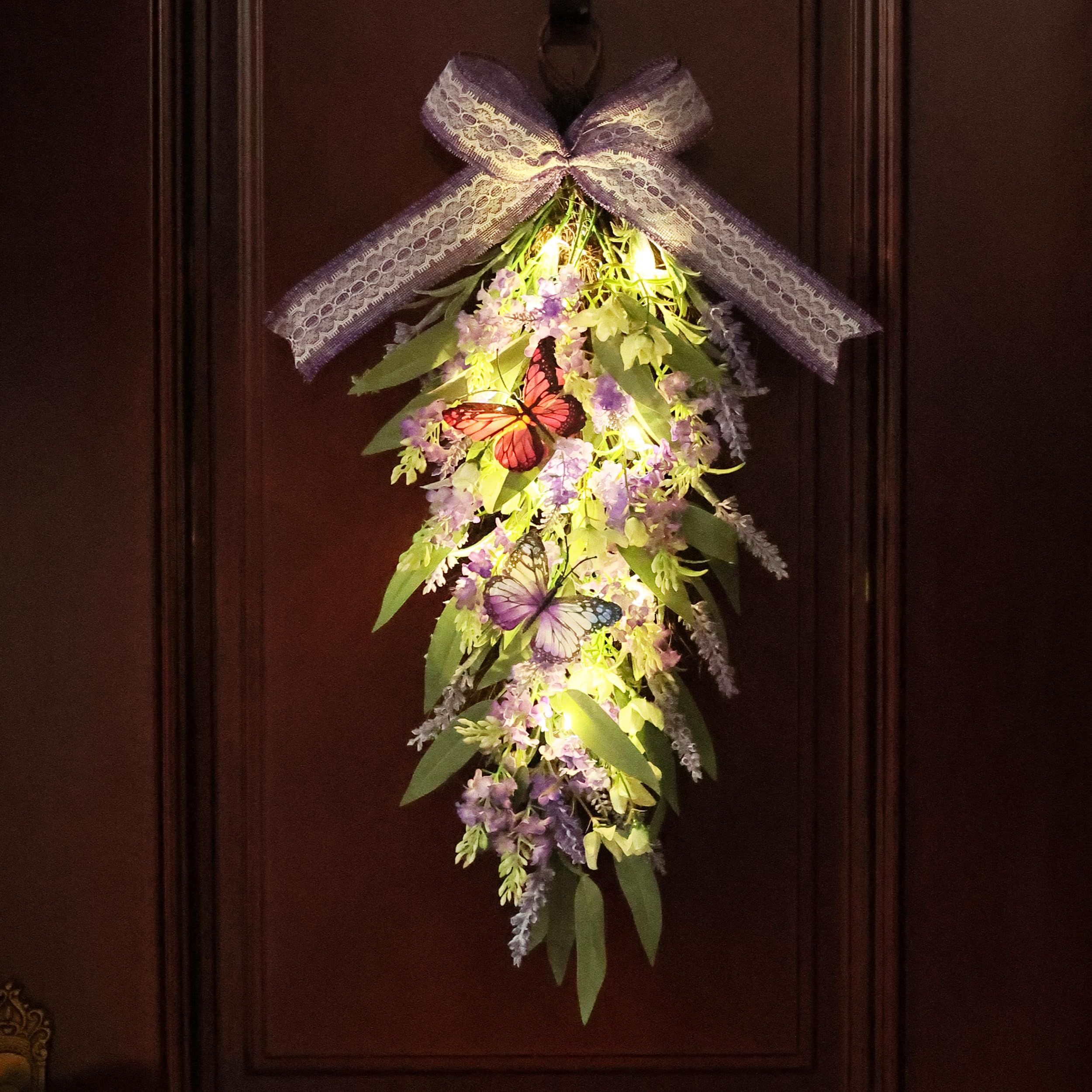 Jusdreen wreath displayed on a mantel showing versatile use as indoor seasonal accent
