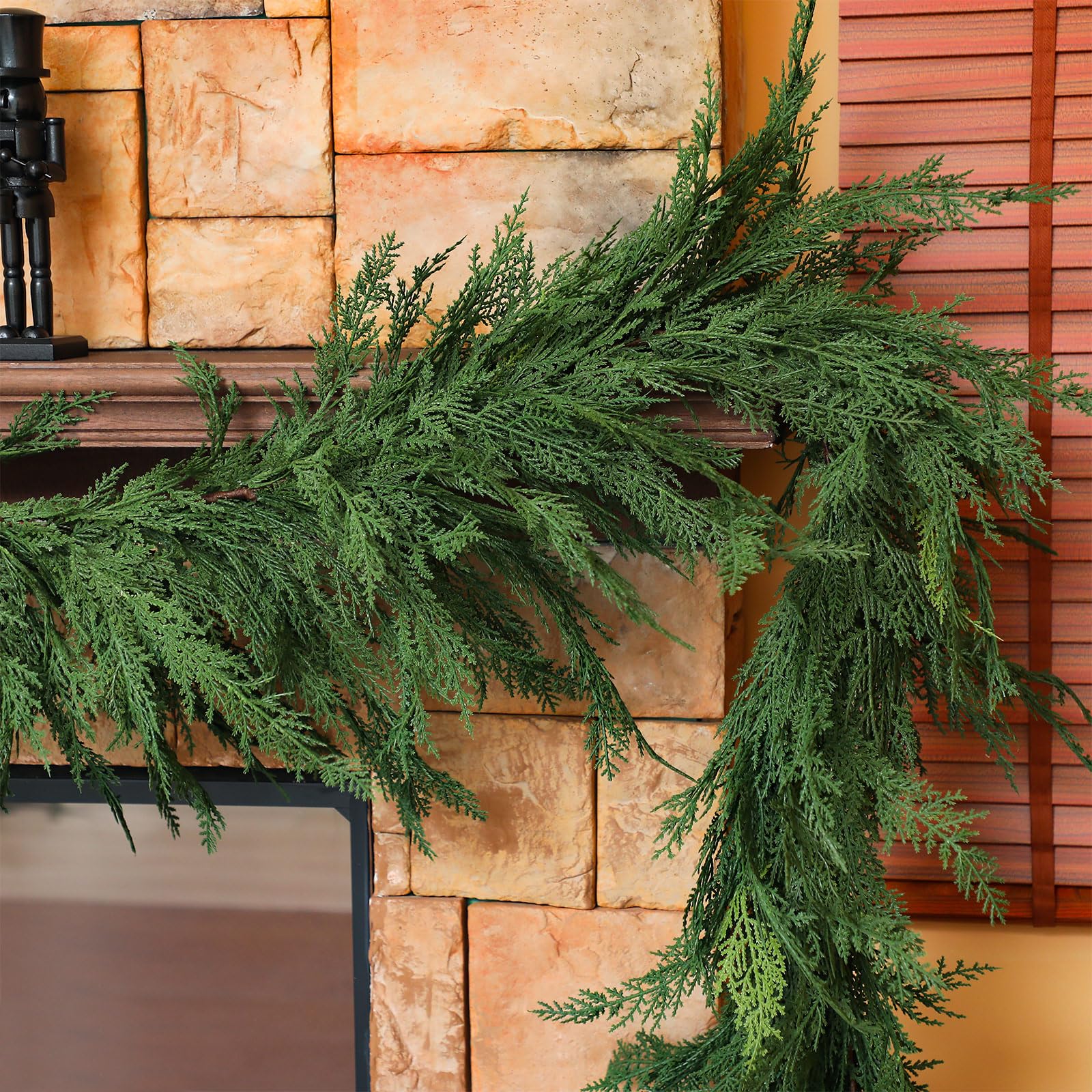 Jutom garland styled on covered porch shows outdoor-ready elegant curb appeal