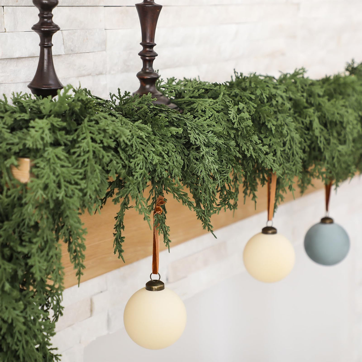 Jutom front view of two 9 ft cedar garlands showing full coverage and realistic look