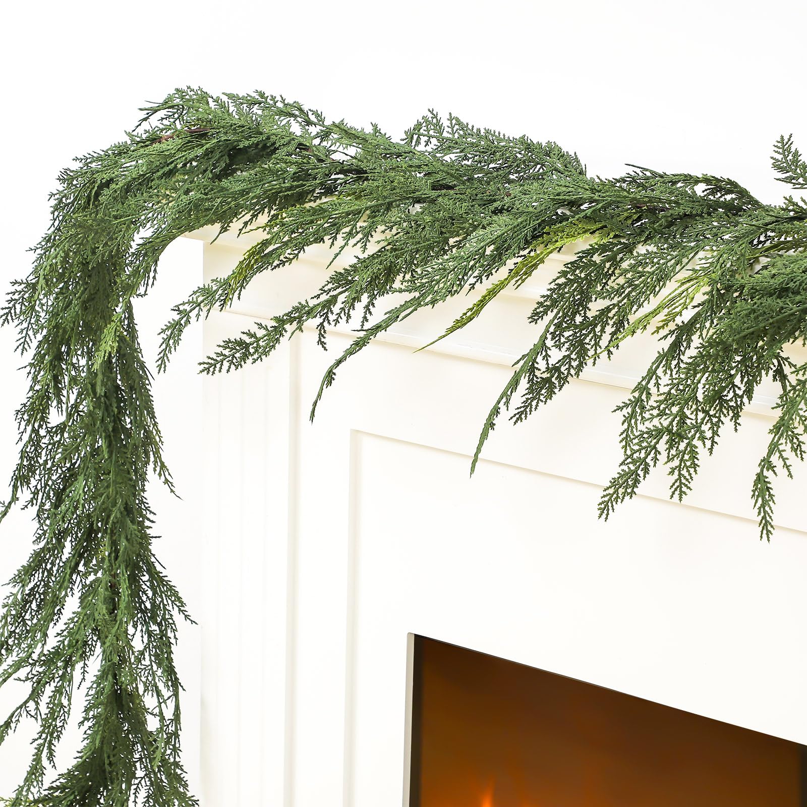 Jutom garland draped on mantel creating cozy holiday ambience and simple decorating benefit