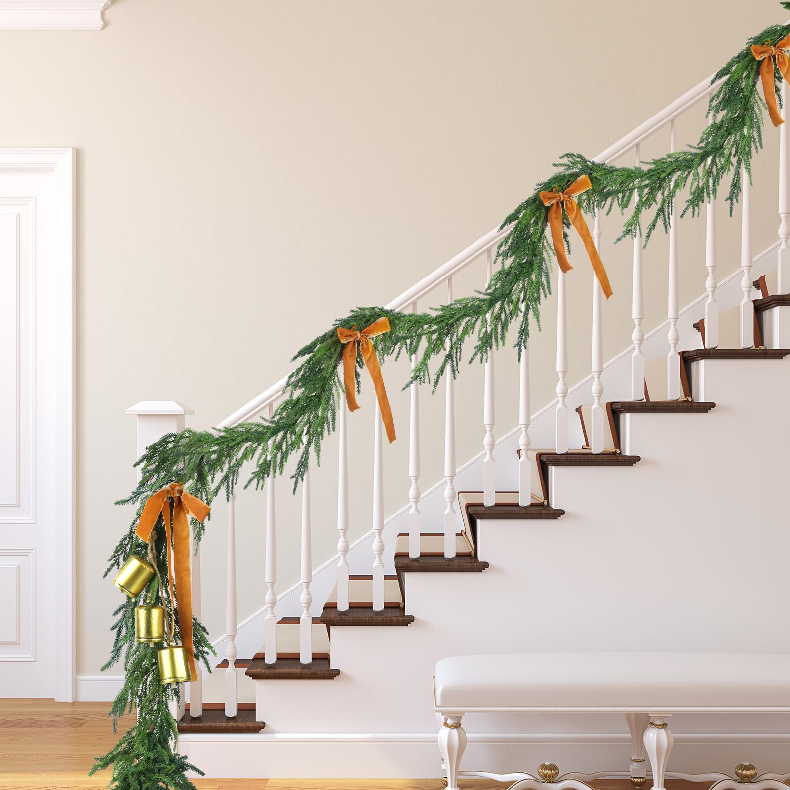 Jutom garland styled along staircase rail adding cohesive holiday charm