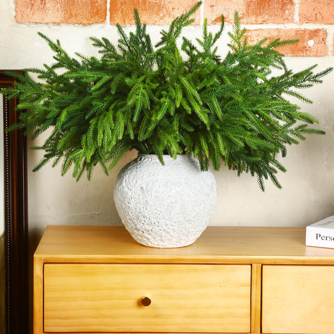 Jutom styled on a fireplace mantel showing festive look and low-maintenance benefit