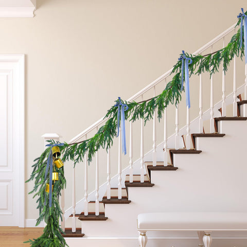 Jutom Norfolk pine garland full-length draped on mantel for festive warmth