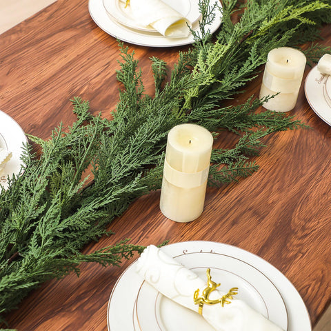 Jutom garland beside hand showing scale and manageable size for hallway or porch