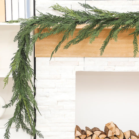 Jutom garland used as table centerpiece adding green fullness and seasonal focal point