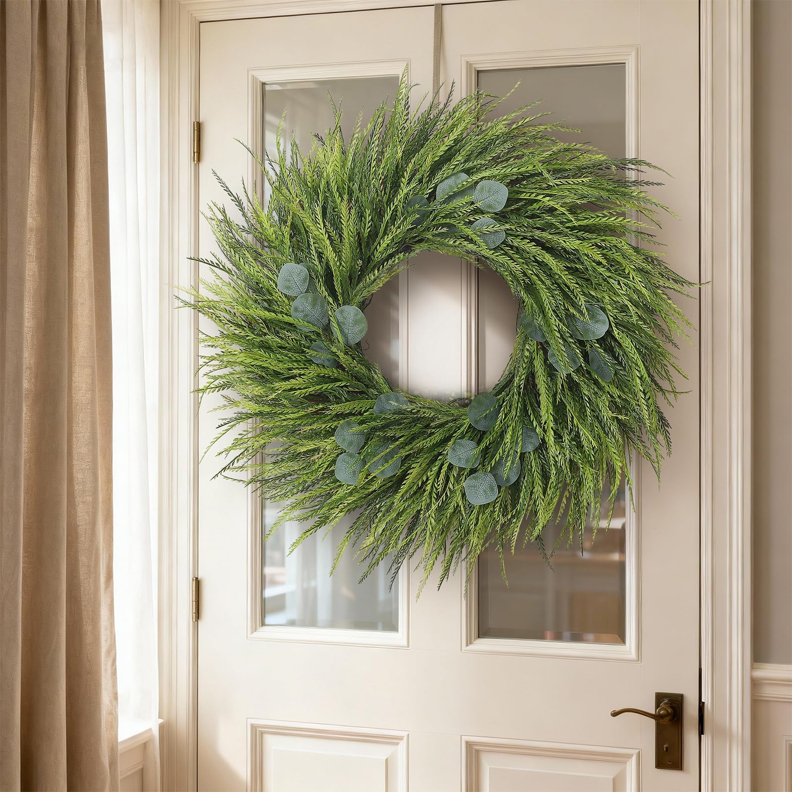 Juxdp wreath above fireplace adding low-maintenance decor charm