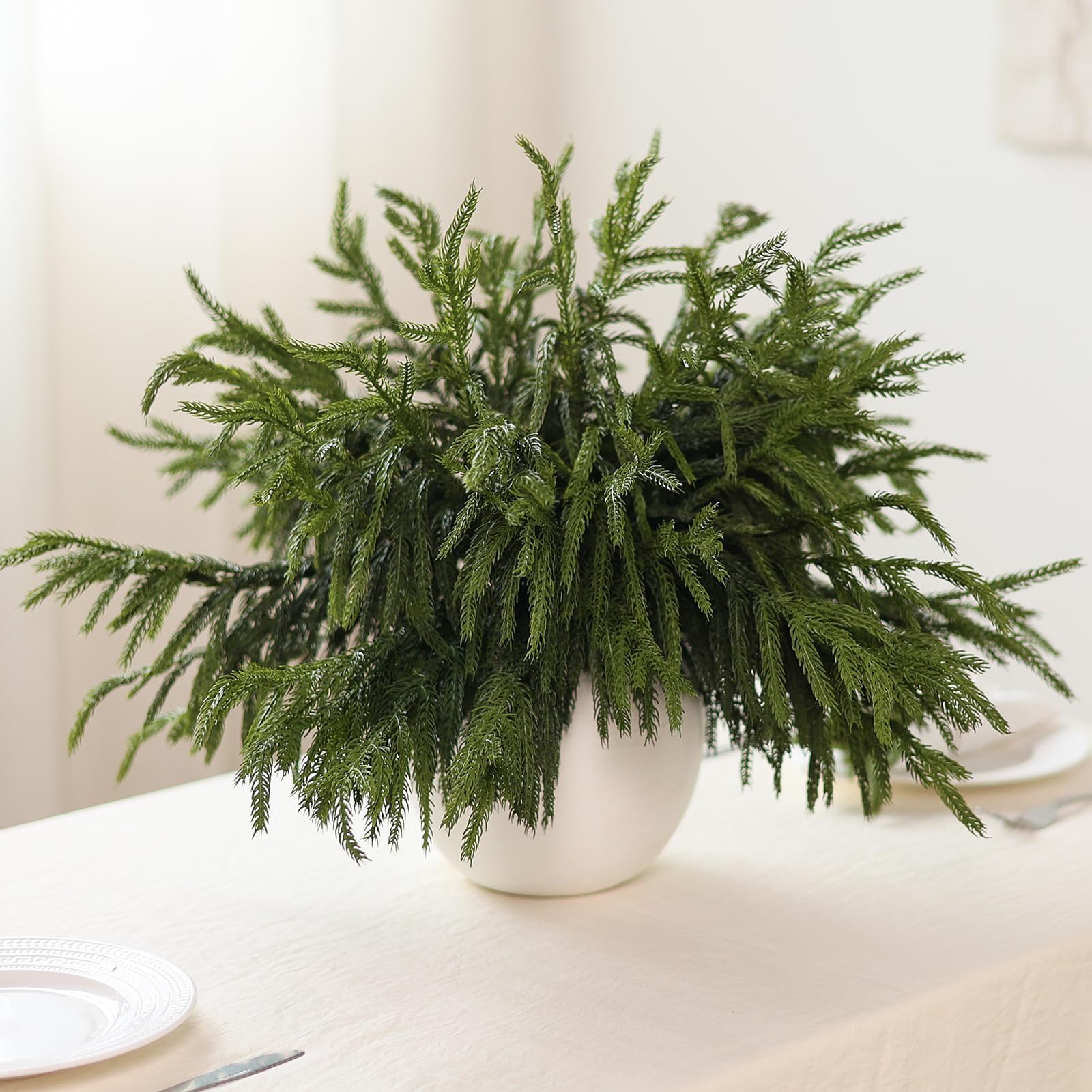 Juxdp Norfolk pine stems styled on fireplace mantel for seasonal ambiance