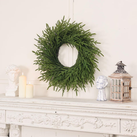 Juxdp wreath hanging on a porch rail demonstrating outdoor use