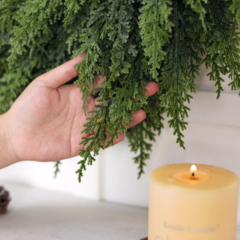 Juxdp wreath above mantel staged in living room for seasonal styling ideas
