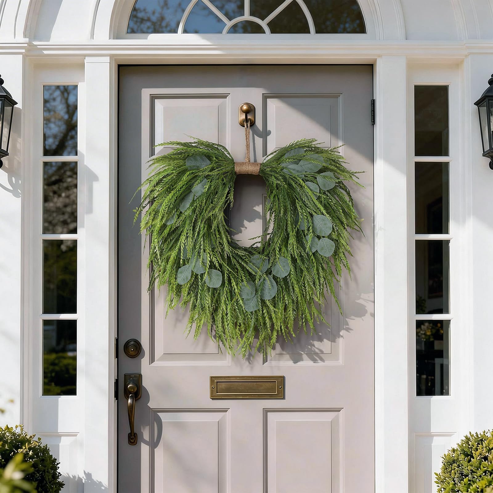 Juxdp wreath next to door hanger showing 22-inch scale for sizing