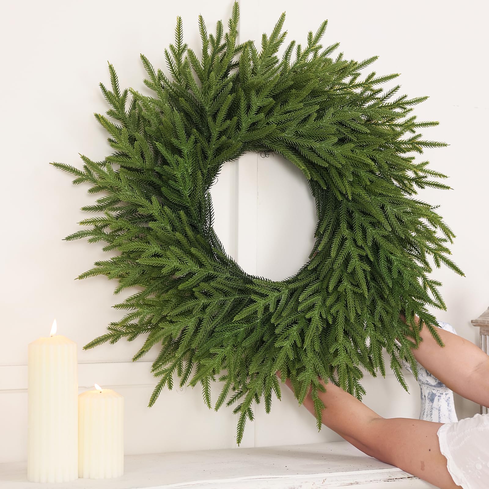Juxdp wreath lit with battery lights showing warm holiday glow